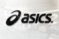 Asics on glossy office wall realistic texture